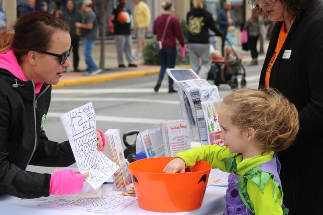 Local children had the chance to trick-or-treat among the many vendors participating in the "Harvest Happenings" farmers market at downtown Fremont on Saturday.