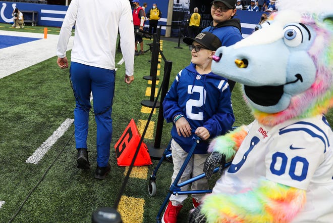 Carson Wentz superfan Giovanni Hamilton watches the team warm up before the game against the Houston Texans on Sunday, Oct. 17, 2021, at Lucas Oil Stadium in Indianapolis. 