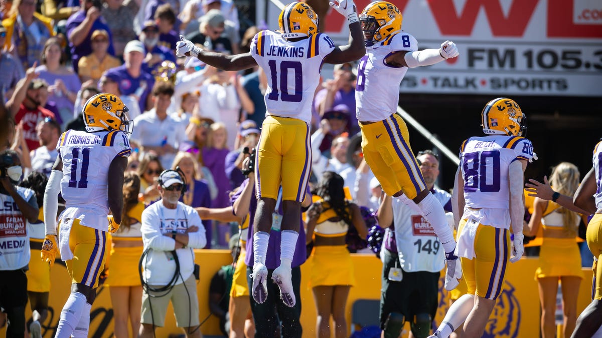 LSU wide receivers Jaray Jenkings (10) and Malik Nabers celebrate during the team's defeat of Florida at Tiger Stadium in Baton Rouge.