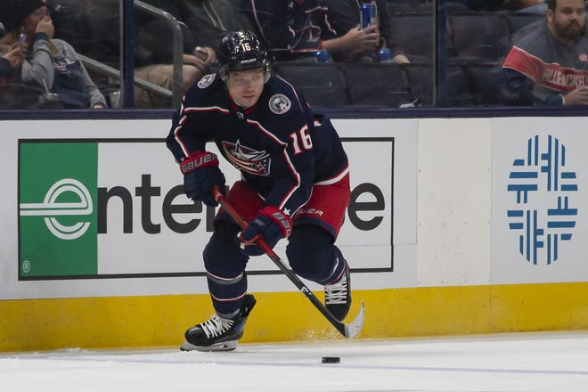 Columbus Blue Jackets center Max Domi (16) looks for a pass after picking up the puck in the defensive end during the NHL game against the Seattle Kraken at Nationwide Arena in Columbus, Ohio Oct. 16. 