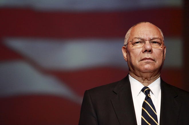 Colin Powell watches the posting of the colors at the Induction Ceremony to the Ohio Veterans Hall of Fame, at the Veterans Memorial Building, Friday, Nov. 5, 2010.