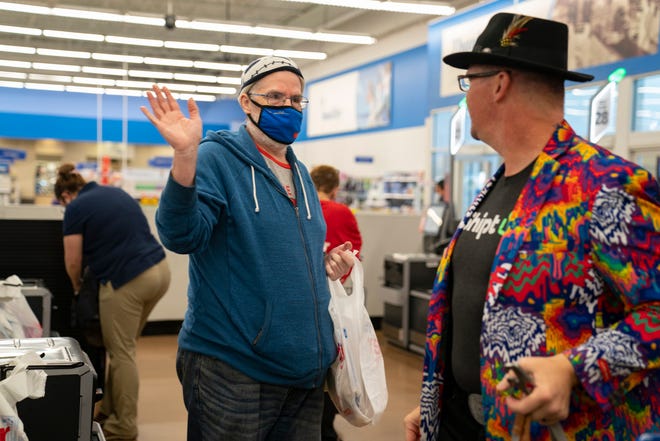 Former Meijer employee David Stoneburgh, left, chats up Robert