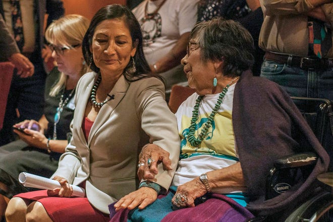 FILE - In this Tuesday, Nov. 6, 2018, file photo, then Congresswoman-elect Deb Haaland speaks to her mother Mary Toya following the news of her election during midterms' election night in Albuquerque, N.M. The mother of now U.S. Interior Secretary Deb Haaland has died, authorities said Sunday, Oct. 17, 2021. Officials with the Department of the Interior didn't immediately release Mary Toya's age or a cause of death. In a statement, Haaland's spokeswoman Melissa Schwartz said "we celebrate Mary Toya's long life and are grateful for her 25 years of service to Native students as a member of the Interior team within Indian Affairs. (AP Photo/Juan Labreche, File)