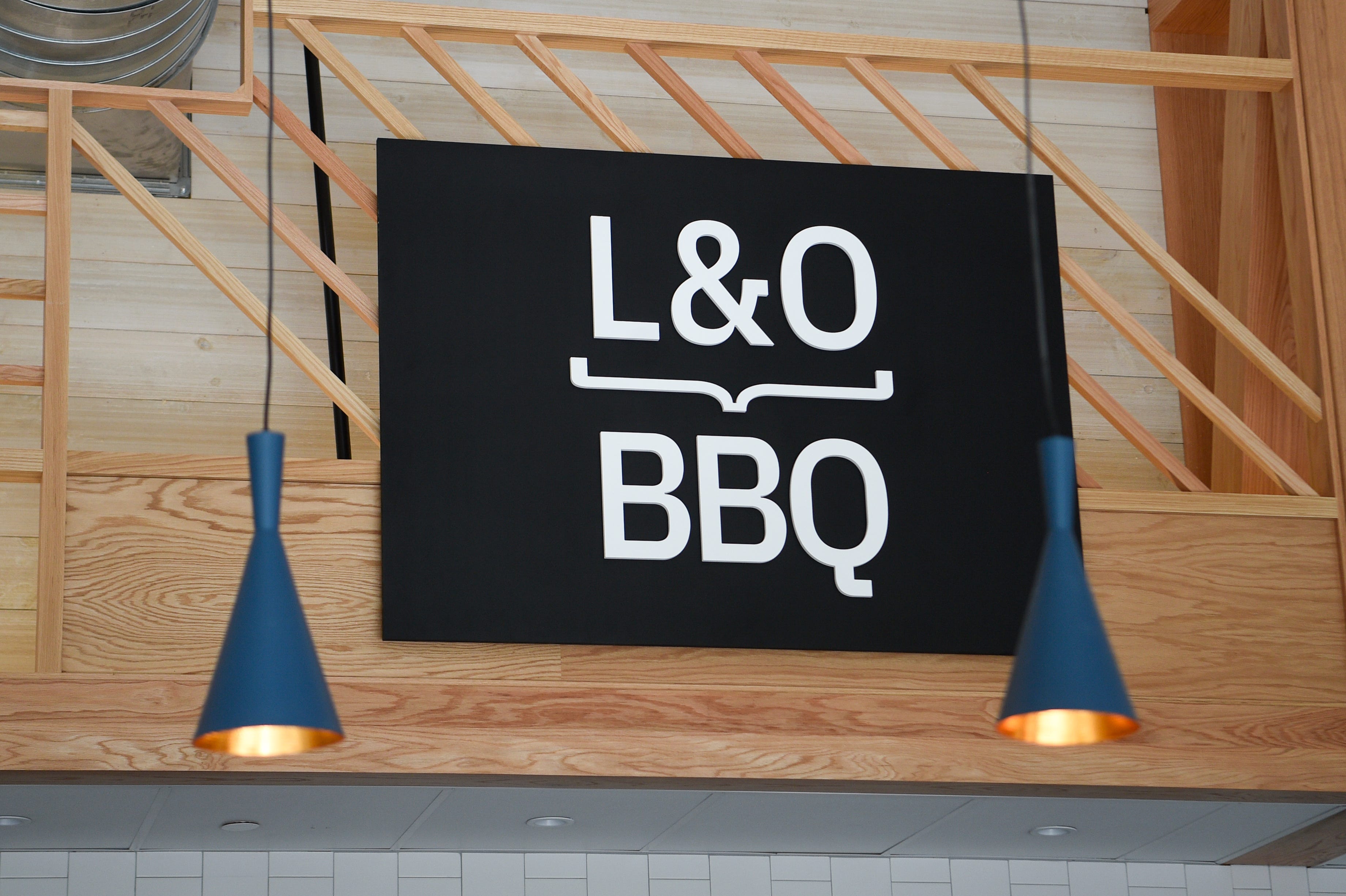 A sign for L&O BBQ is seen at Marble City Market, a food hall at the Regas Square building in downtown Knoxville, on Friday, Oct. 15, 2021. 