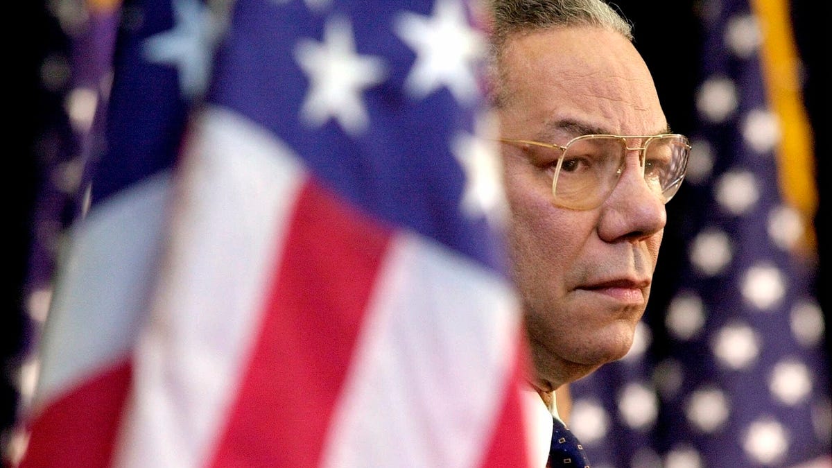 - In this Feb. 15, 2001 file photo, Secretary of State Colin Powell looks on as President Bush addresses State Department employees at the State Department in Washington. Powell, former Joint Chiefs chairman and secretary of state, has died from COVID-19 complications, his family said Monday, Oct. 18, 2021.