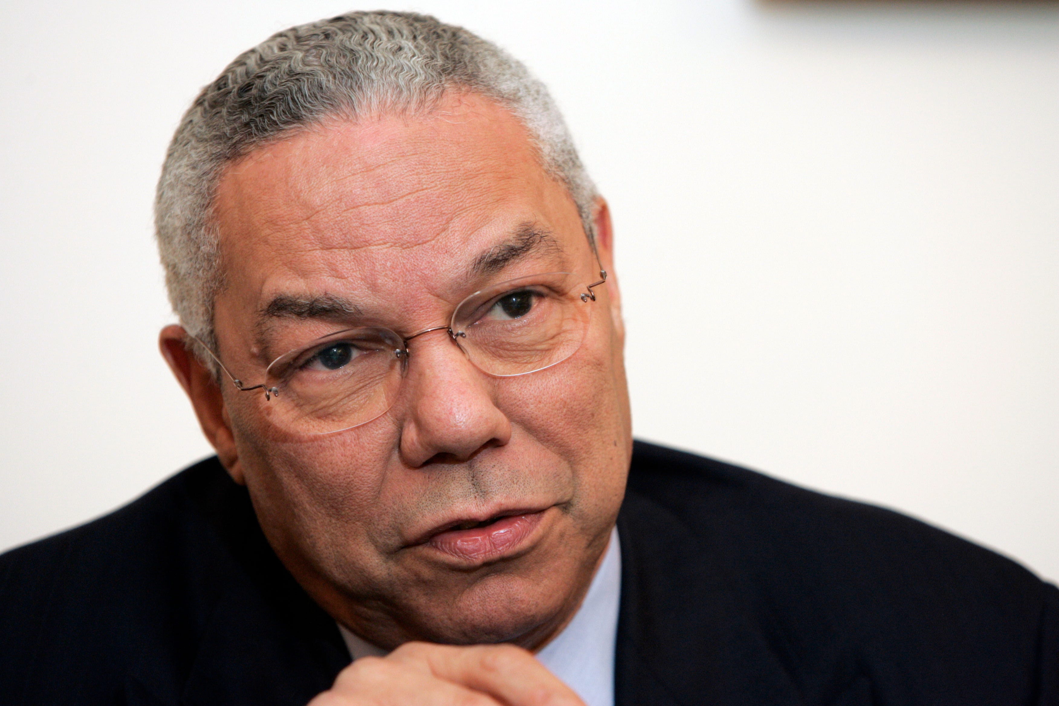 Colin Powell looks to the side.