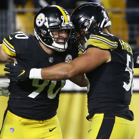 T.J. Watt (90) celebrates with teammates after for