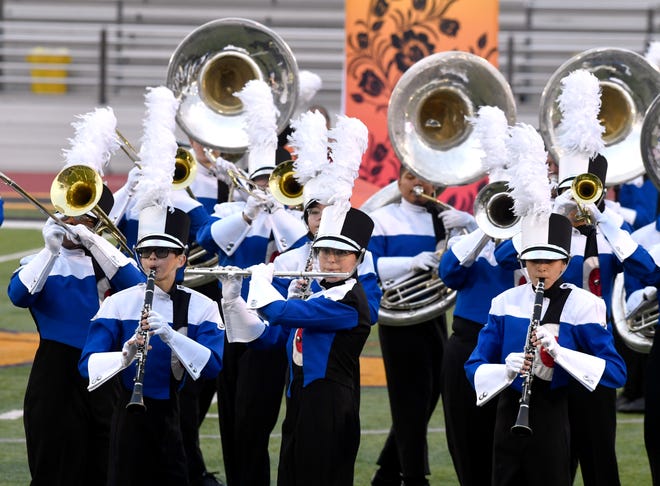The Cooper Cougar Band performs during the UIL Region 6 marching band contest at Wylie High School Monday.
