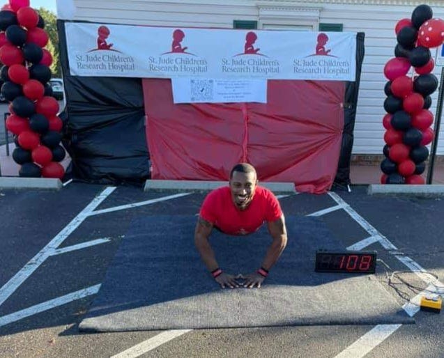 Issac Coleman, 36, broke the Guinness World Record for the most diamond push-ups in 60 seconds in front of a Guinness judge Sunday to raise money and awareness for kids battling cancer.