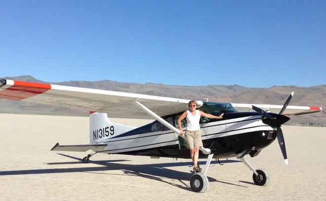 Pilot Christine Mortine with the plane that later crashed in a local ravine.