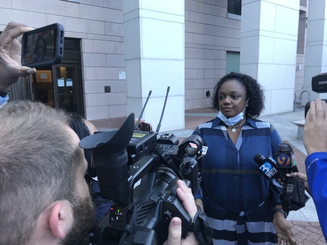 Almera Jones Schofield, speaking with reporters prior to Charles Combs's first appearance in court after being charged with the first-degree murder of 30-year-old Laporscha Baldwin.