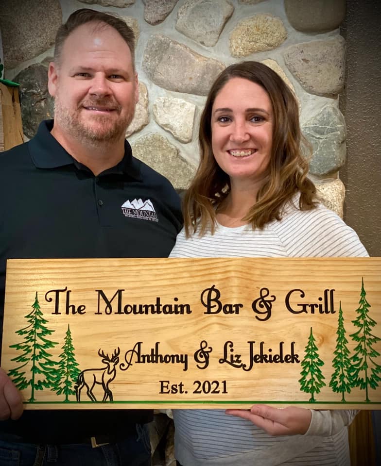 Owners Anthony and Liz Jekielek pose for a photo shortly after acquiring The Mountain Inn, now The Mountain Bar and Grill, in February 2021.