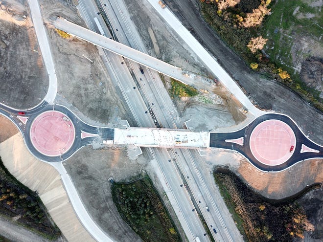 This bird's eye view of the LaPlaisance Road overpass shows the new roundabouts. The old bridge is to be taken down this weekend.