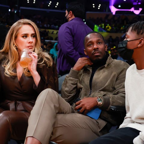 Singer Adele, left, and Rich Paul, center, attend 