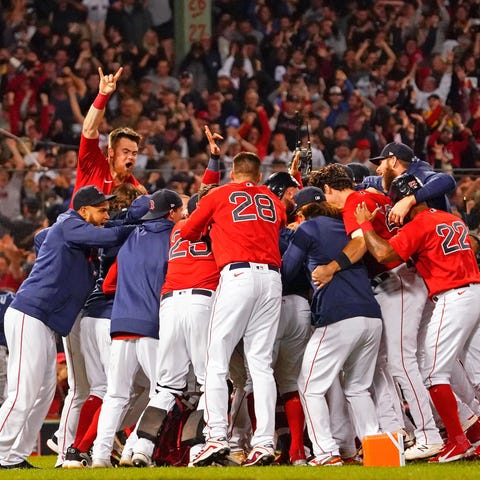 Red Sox players celebrate their win in Game 4 of t