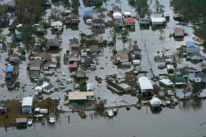 In this Wednesday, Sept. 1, 2021 file photo, floodwaters slowly recede in the aftermath of Hurricane Ida in Lafitte, La. On Thursday, Oct. 14, 2021, the National Oceanic and Atmospheric Administration announced that a La Nina has formed, which can be bad news for parts of the parched West. It also could mean a more active Atlantic hurricane season.