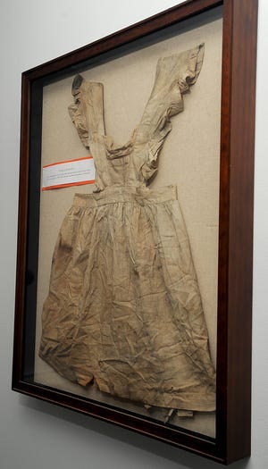 The infamous "bloody dress" that is on display at Stone's Public House in Ashland. The dress is believed to have been worn by Mary J. Smith, 11, who was struck by a train on June 11, 1863.