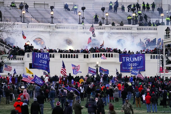 FILE - In this Jan. 6, 2021, file photo, violent protesters, loyal to President Donald Trump, storm the Capitol in Washington.