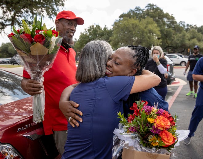 Inger Gasper, right, thanks registered nurse Lily DeVarona for saving the life of her bother, Rod Glasper, left, at St. David’s Round Rock Medical Center on Friday.