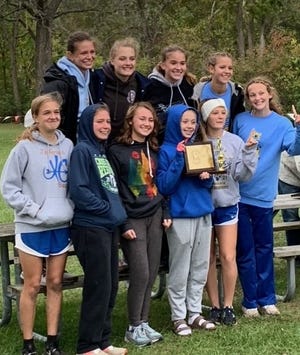 Jefferson's girls celebrate after winning the Huron League cross country championship Thursday.
