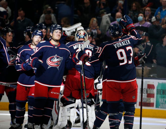 The Blue Jackets celebrate a win with Columbus Blue Jackets right wing Patrik Laine (29) goal during the NHL game in Columbus, Ohio, on Thursday, Oct. 21, 2021. 