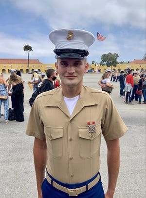 U.S. Marine Lance Cpl. Gabe Heefner is in critical condition after being struck in the head by a stray bullet in Iowa City on Sunday.