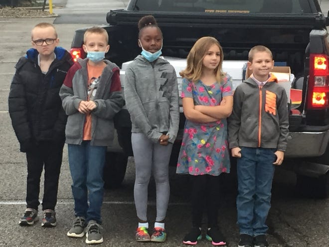 Third-grade leadership students from Sherman Elementary School drop off food for the 18th annual Make a Difference Day.