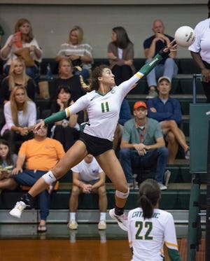 Amiah Butler (11) plays the ball during the Florida State University High School vs Pensacola Catholic High School District 1-3A volleyball tournament championship at Pensacola Catholic High School in Pensacola on Thursday, Oct. 21, 2021.