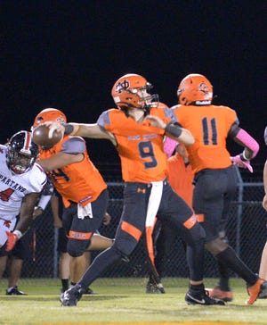 North Davidson quarterback Gavin Hill and the Black Knights rolled again Friday in the first round of the 3-A state playoffs. [Mike Duprez/The Dispatch]