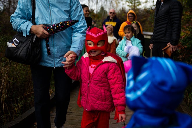 Families brave the rainy weather for Trails and Treats hosted by the Outdoor Discovery Center Saturday, Oct. 23, 2021, at the ODC located at 4214 56th Street in Holland. 
