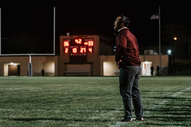 Granite Hills head coach Alex Gonzalez yells out to his team during the fourth quarter against Victor Valley on Oct. 22, 2021.