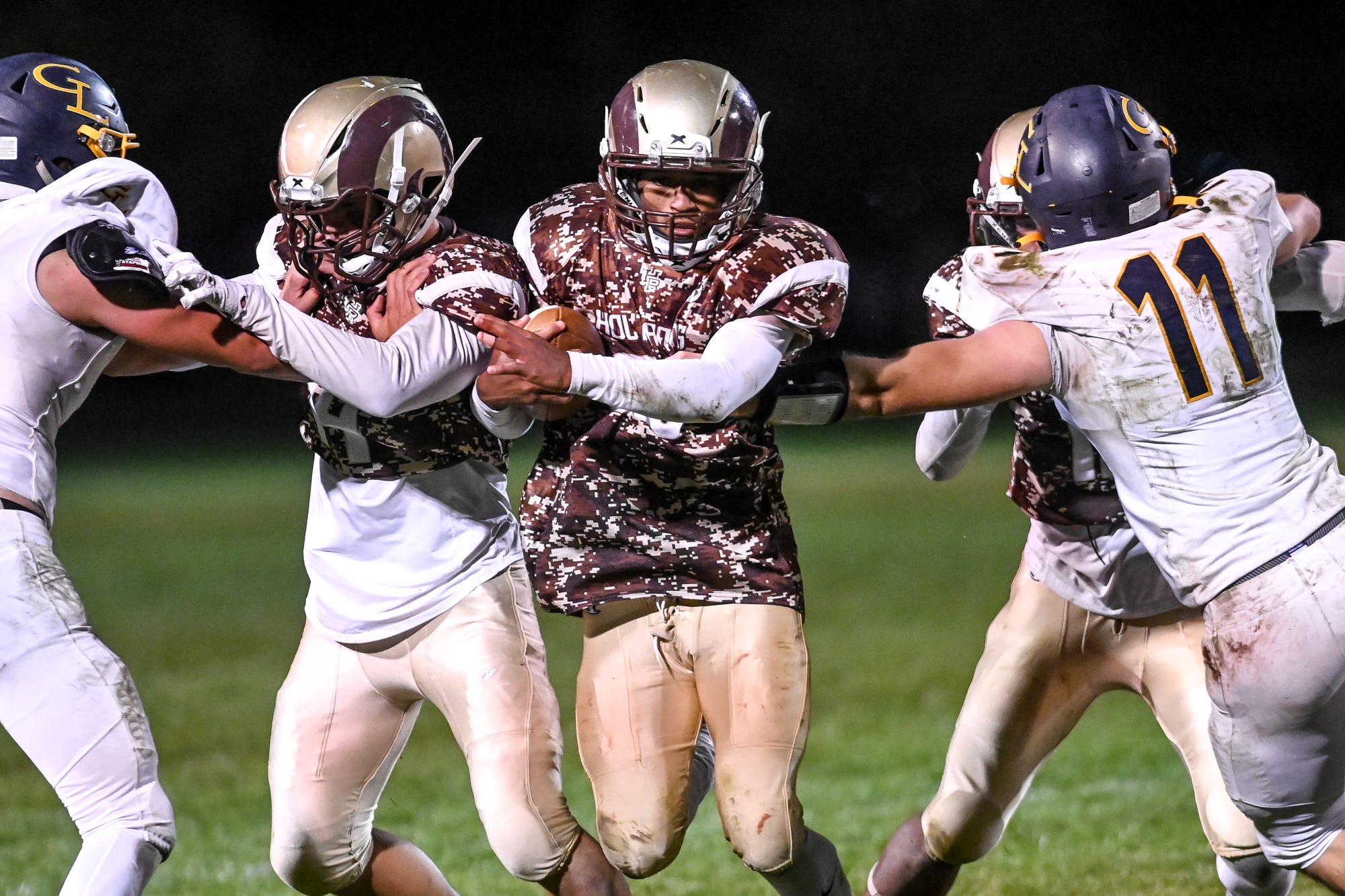 Holt football dominant on both sides of ball in rivalry win over Grand