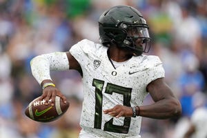 Oct 23, 2021; Pasadena, California, USA; Oregon Ducks quarterback Anthony Brown (13) throws the ball against the UCLA Bruins in the first half at Rose Bowl. Mandatory Credit: Kirby Lee-USA TODAY Sports