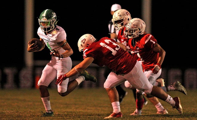 Korbin Covarrubiaz (4) rushes the ball for Eldorado during a game against Christoval on Friday, Oct. 22, 2021.