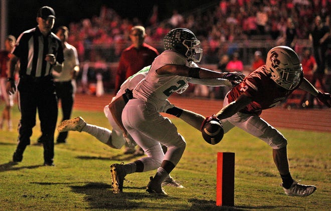 Beau Jolly, far right, reaches across the end zone during a run for Christoval against Eldorado on Friday, Oct. 22, 2021.