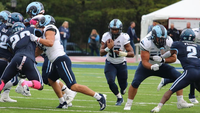URI's Justice Antrum finds a hole against the Villanova defense on Saturday. Antrum ran for 60 yards on nine carries.