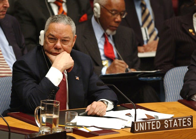 U.S. Secretary of State Colin Powell reacts as he listens to Iraq's ambassador to the U.N., Mohammed al-Douri, address the United Nations Security Council, in which he answered and mostly denied Colin Powell's accusations, on Feb. 5, 2003, in New York. (Nicolas Khayat/Abaca Press/TNS)