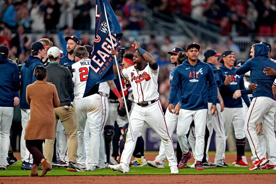 The Braves celebrate after beating the Dodgers in Game 6 of the NLCS.