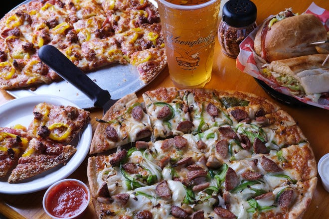 Beer cheese bratwurst pizza, Big Al's pizza, Italian sub and a 32-ounce Yuengling beer (priced at $3.50) at JT’s Pizza, Pub and Patio on Dublin Granville Road in the Linworth area.