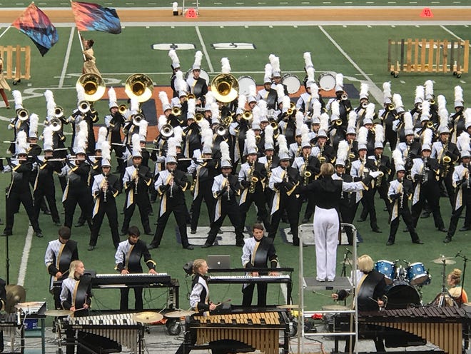 The Galesburg High School Marching Streaks perform at Memorial Stadium Saturday during the Illinois Marching Band Championships in Champaign. The Marching Streaks took 2nd place in Class 4A behind Washington High School.