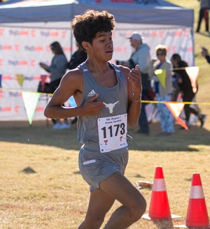 Big Spring's Isaac Gonzales crosses the finish line and places ninth during the UIL Region I Cross Country Championships on Monday, Oct. 23, 2021, at Mae Simmons Park in Lubbock, Texas.