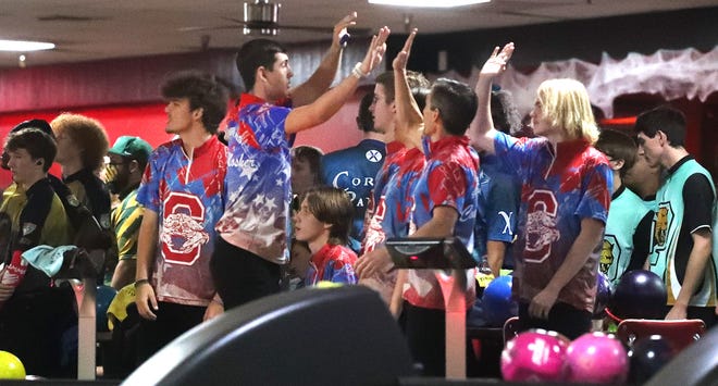 Seabreeze High team celebrates a strike, Tuesday October 26, 2021 during the District 3 Boys/Girls Bowling Tournament at the AMF Deltona lanes.
