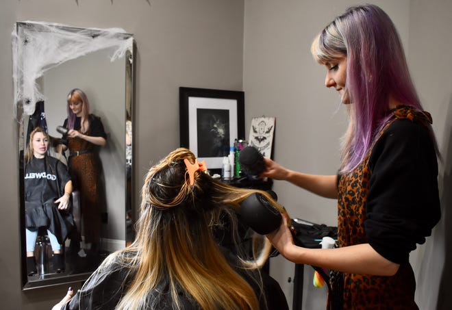 Mari Felo, an independent hairstylist at Atlya Studio, blows client Michelle Kennedy's hair on Friday, October 22 at the Endwell studio.