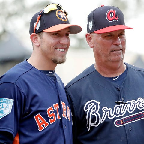 Astros hitting coach Troy Snitker, left, stands wi