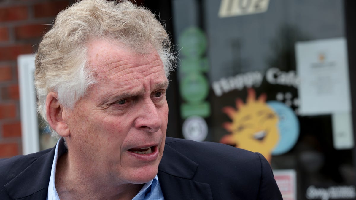 Democratic gubernatorial candidate, former Virginia Gov. Terry McAuliffe answers questions from reporters after speaking during a campaign event where he received the endorsement of the Virginia Beach African American Political Action Council at The Happy Cafe on October 25, 2021 in Virginia Beach, Virginia.