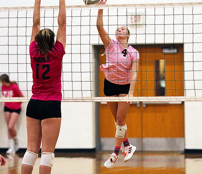 Adison Nettleman of Sturgis pounds a kill home against Schoolcraft in the Spike Out Cancer volleyball match held on Tuesday.
