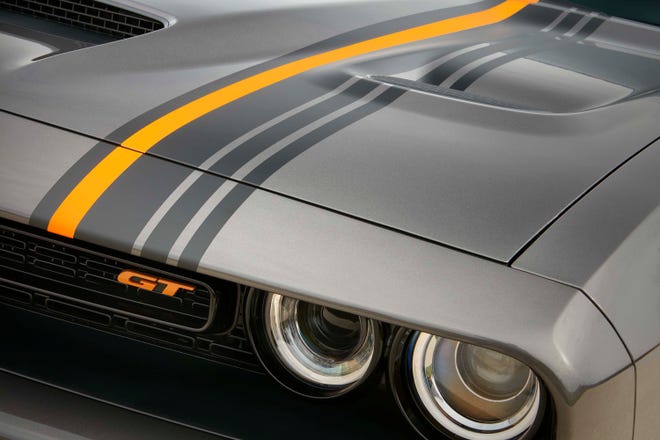 The HEMI Orange appearance package for the 2022 Dodge Challenger and Charger GT RWD and Scat Pack Widebody models includes an orange accent tracer that complements vehicle-length gunmetal striping.