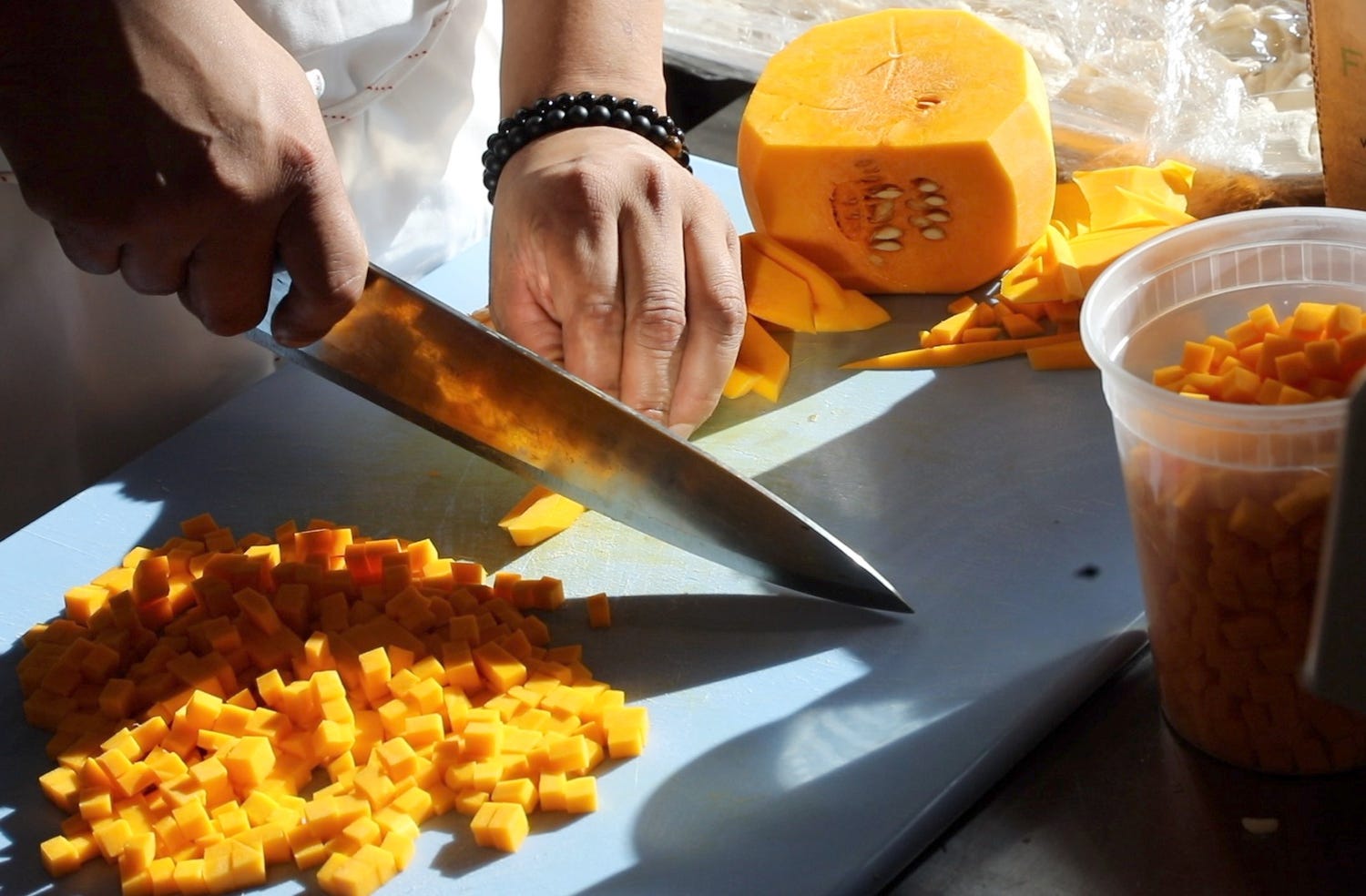 Pumpkin being chopped as part of preparation for dinner at the restaurant, 1776 by David Burke in Morristown on October 19, 2021.