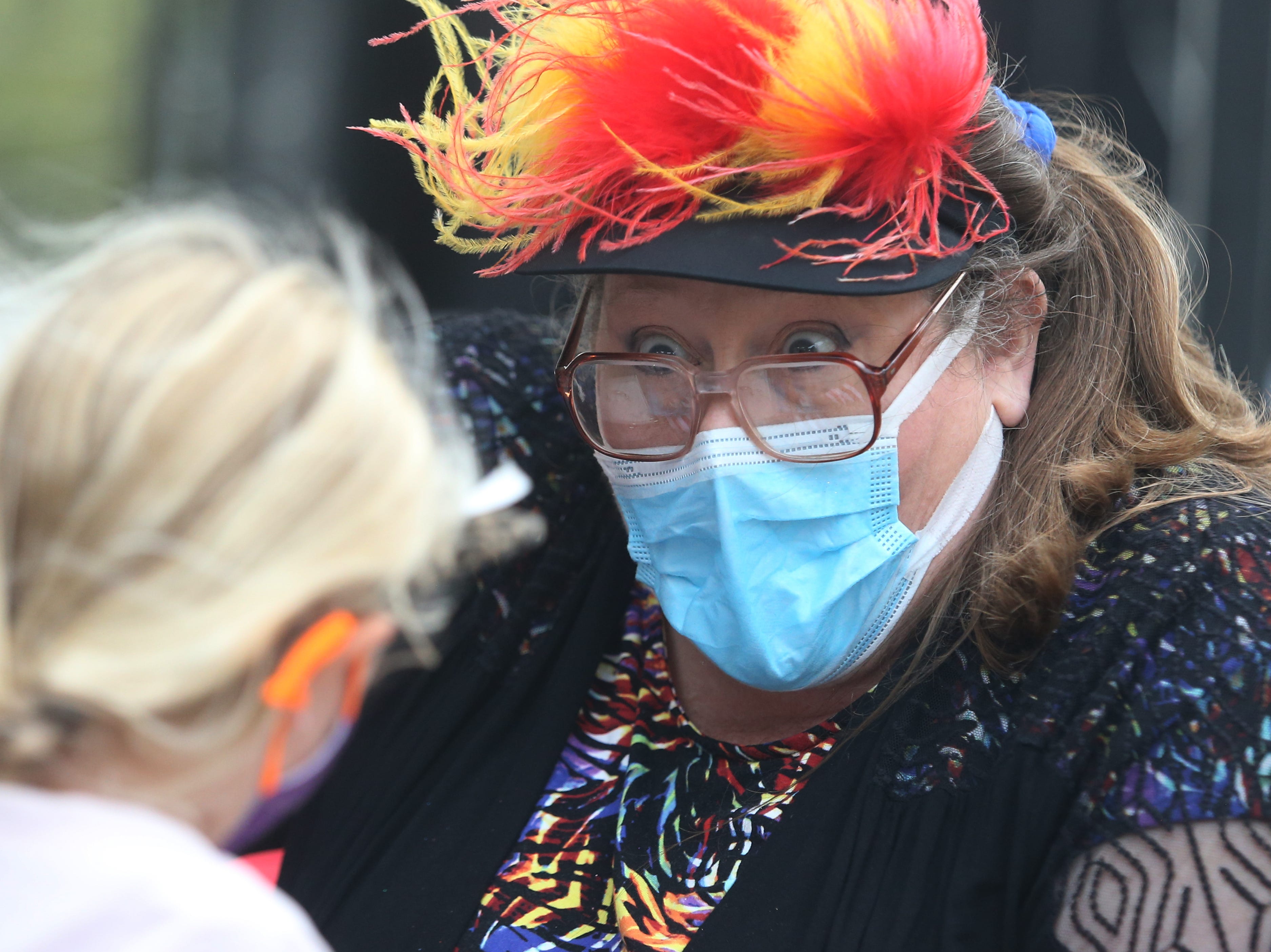 Patti Meyer of Dover, Pennsylvania, is painting tattoos on children looking to meet authors and find books as part of the Morristown Festival of Books on October 14, 2021.