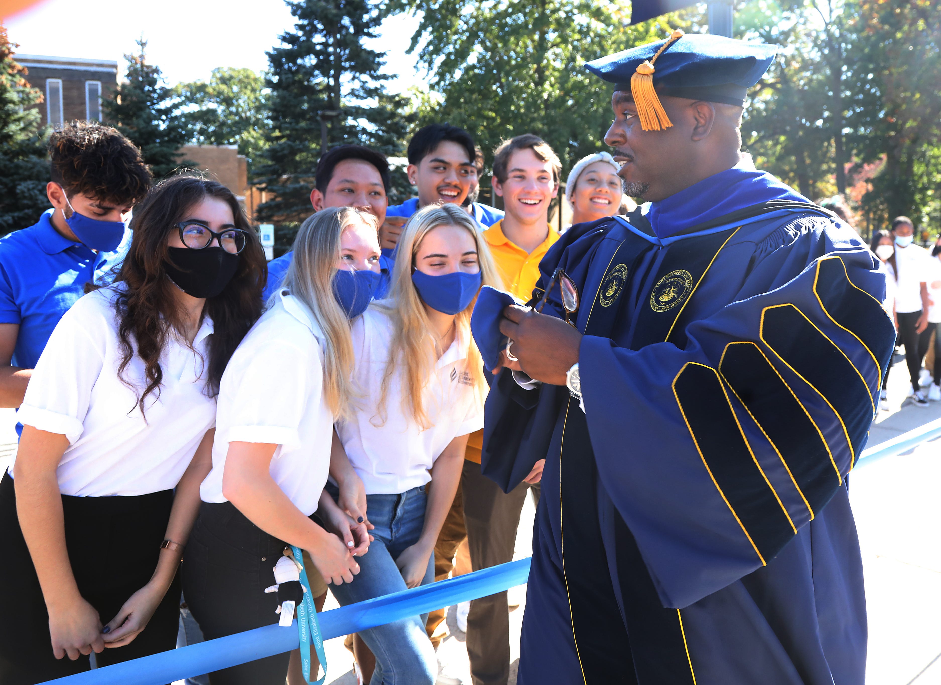 Dr. Gary Crosby with students during a procession ceremony to celebrate his installation as the first Black president of Saint Elizabeth University in Morristown on October 21, 2021.